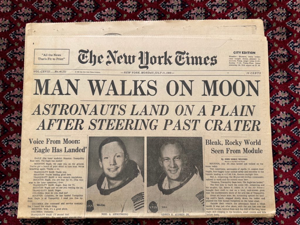 New York Times newspaper front page from Monday, July 21, 1969 with the headline "MAN WALKS ON MOON"