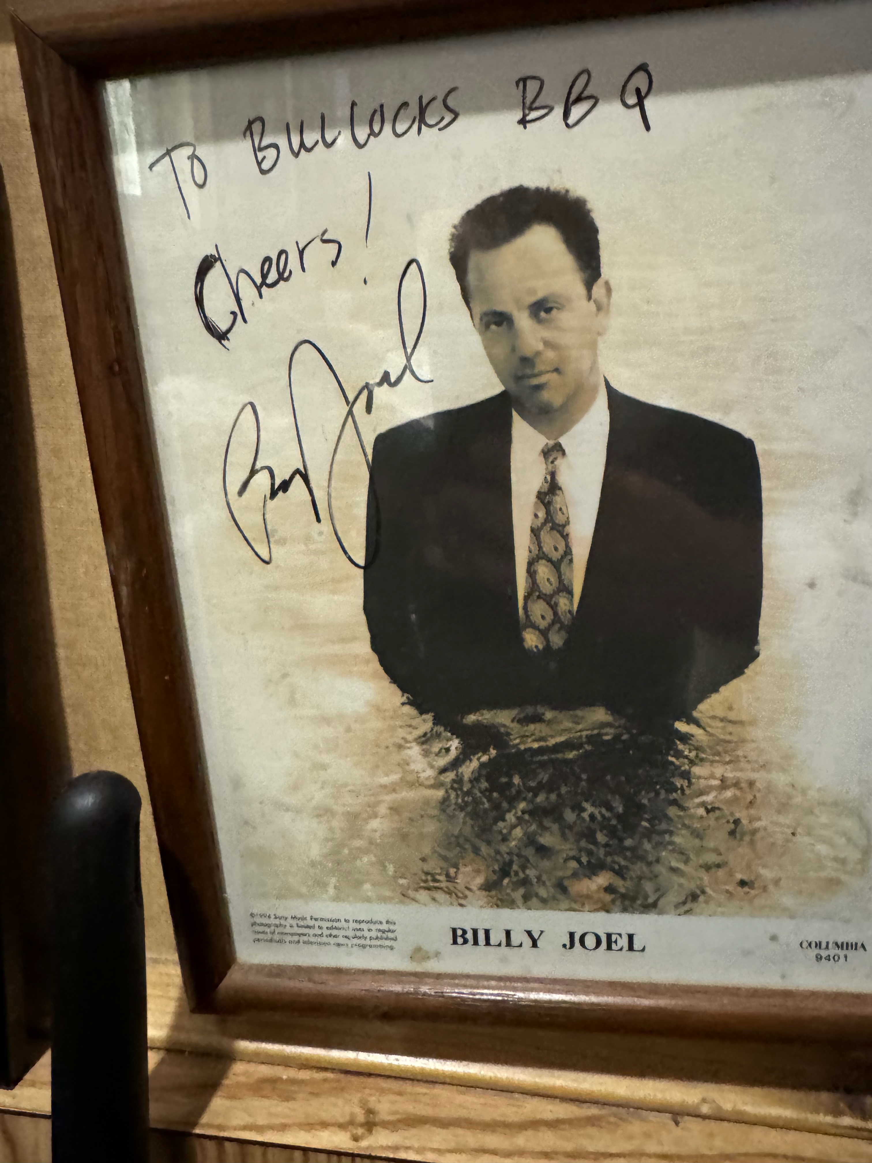autographed picture of Billy Joel at Bullock’s Bar-B-Cue in Durham, NC