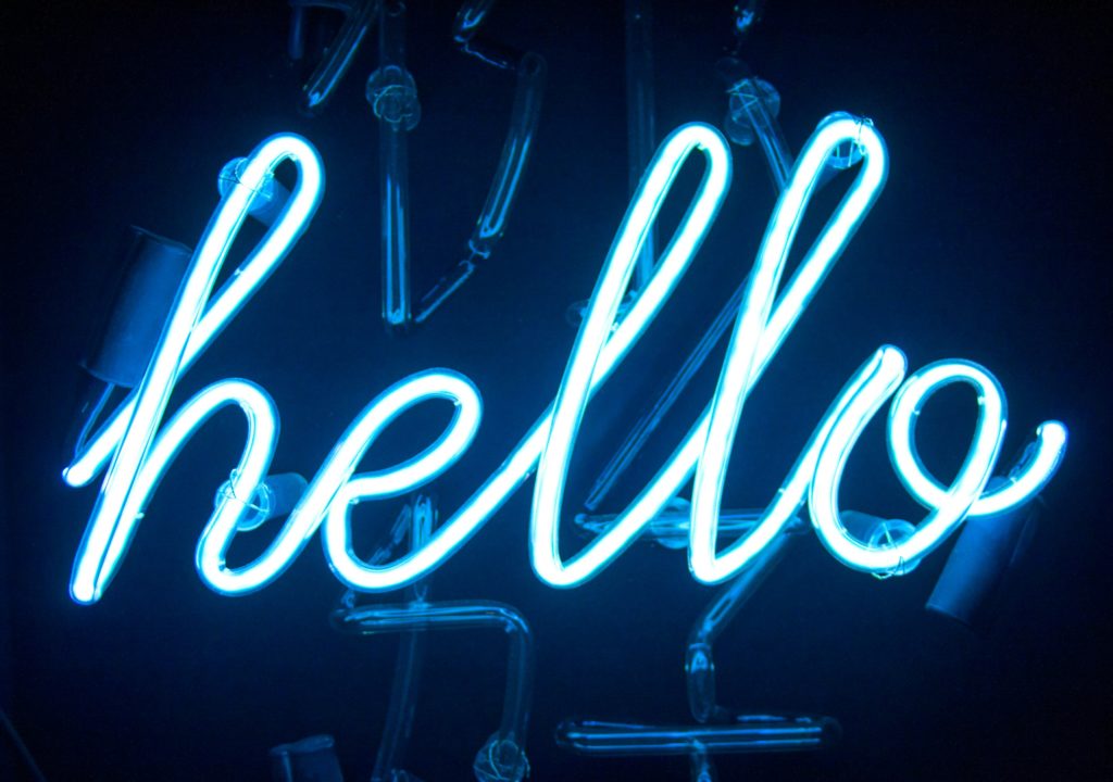 blue neon light “hello"