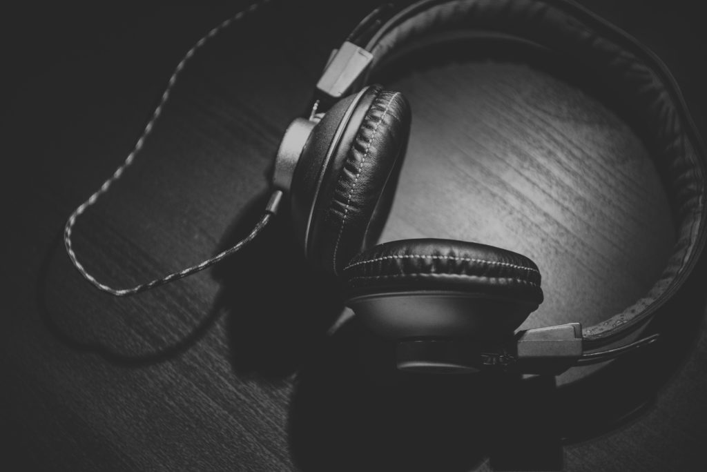 black and white image of over the ear headphones