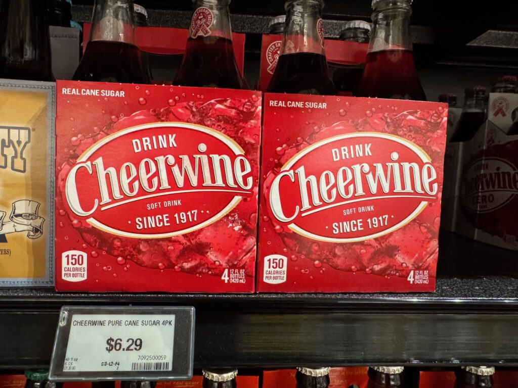 grocery store price display for the Salisbury, North Carolina classic cherry flavored soft drink Cheerwine