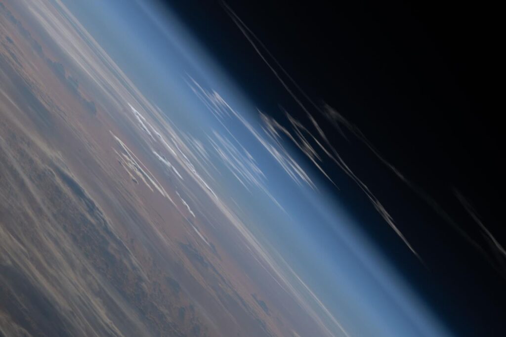 The exhaust plume left behind by the SLS (Space Launch System) rocket that launched Artemis II, NASA’s first crewed mission to the Moon since December 1972, dissipates in the Earth's atmosphere in this photograph from the International Space Station. NASA ID: iss074e0431736